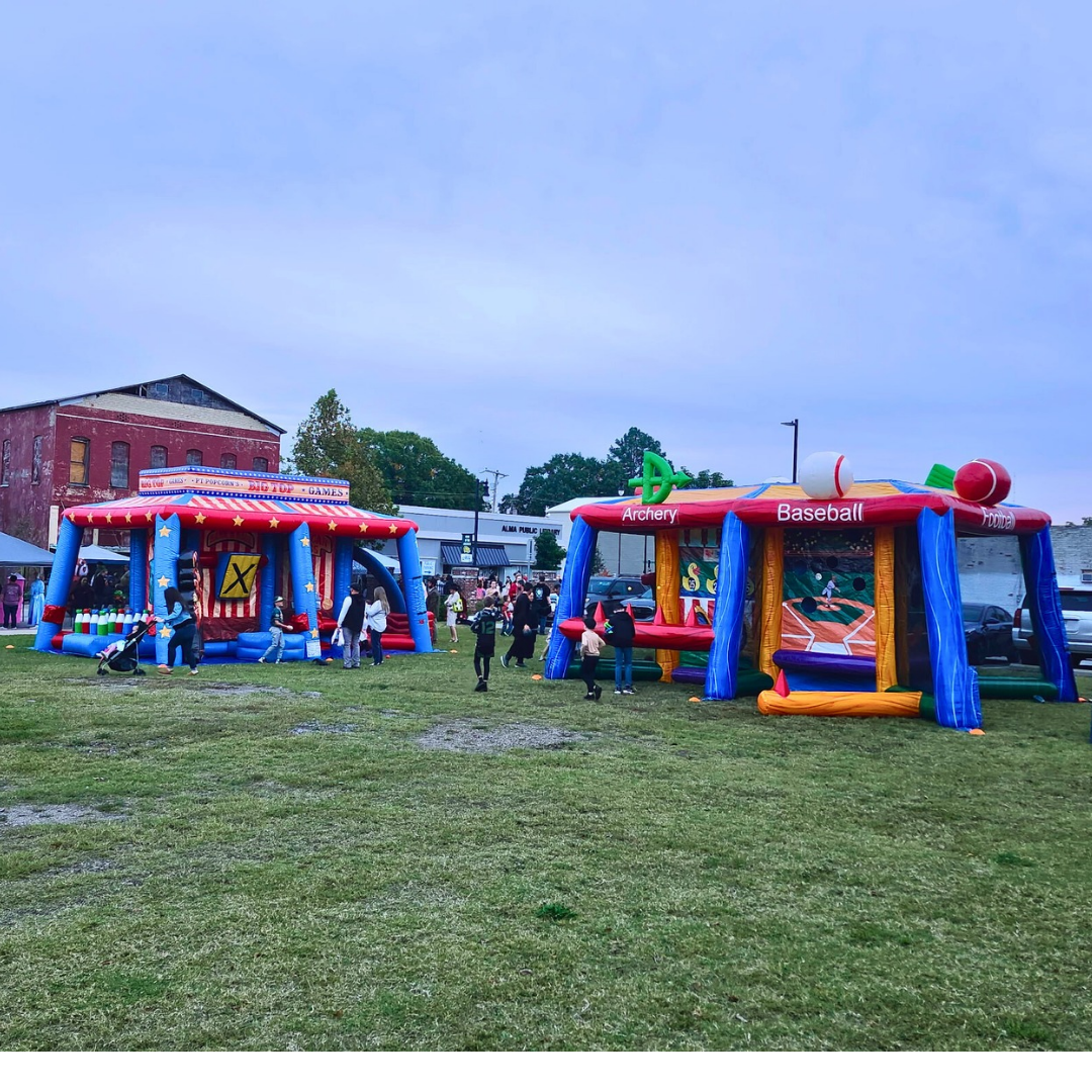Bullfrog Bouncers carnival games setup at outdoor event in Arkansas