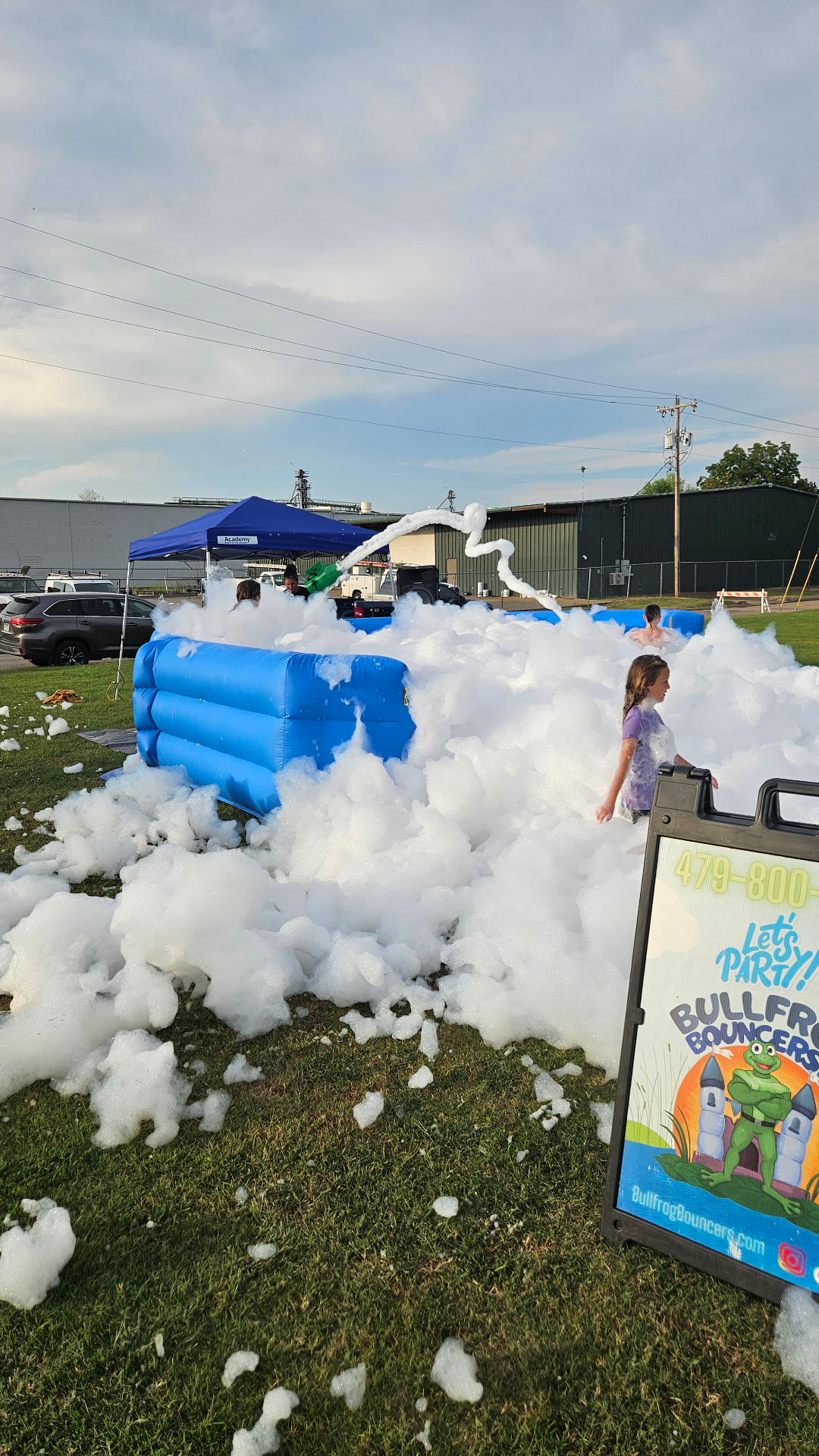 Foam party rental with Bullfrog Bouncers sign in Arkansas